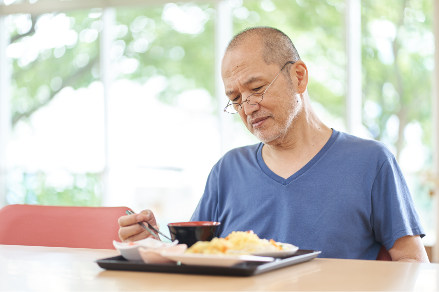 Old Man with food on the table