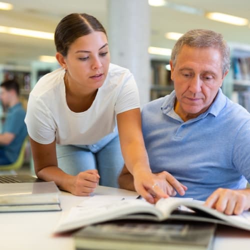 Senior man supporting the library 