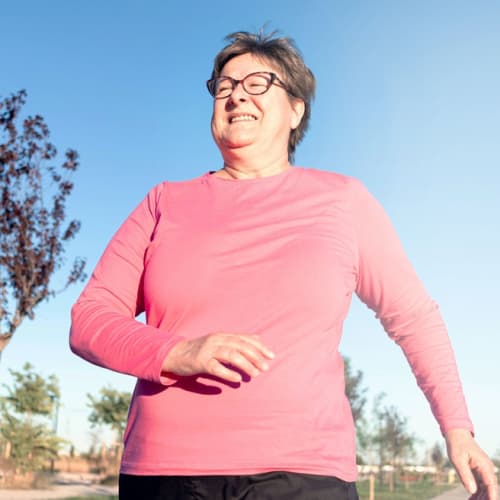 Senior walking in the garden 