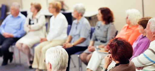A group of elderly people attending seminar