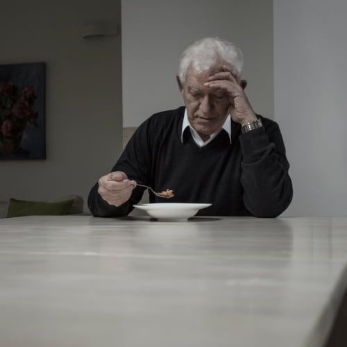 Old man eating alone