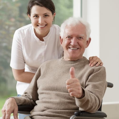 Optimistic old man on wheel chair