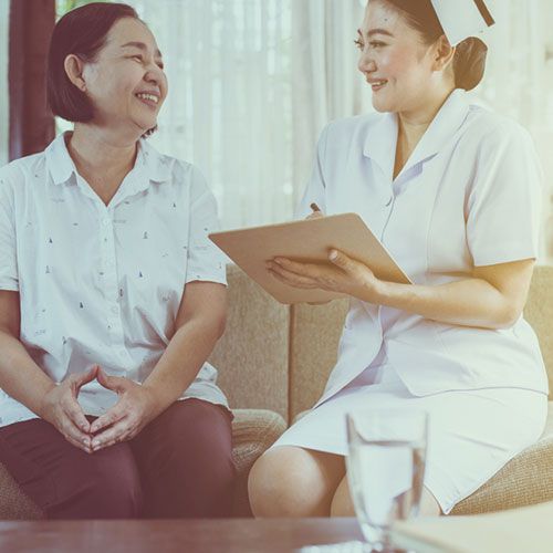 Women and nurse in discussion