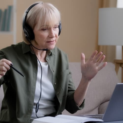 Senior women mentoring over  video call