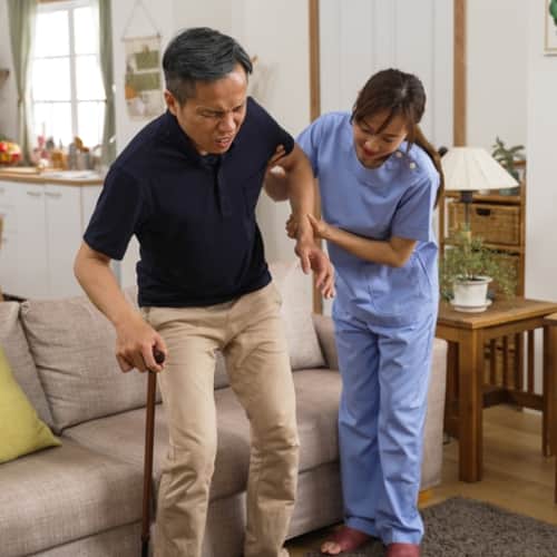 an elderly is trying to walk 