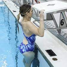 Women doing pull-ups in Swimming Pool
