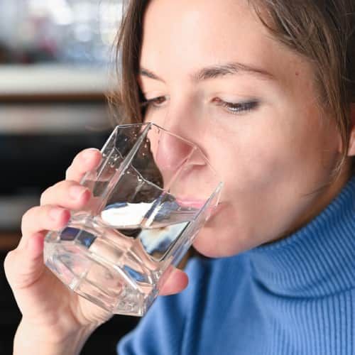 Women drinking water to avoid dehydration
