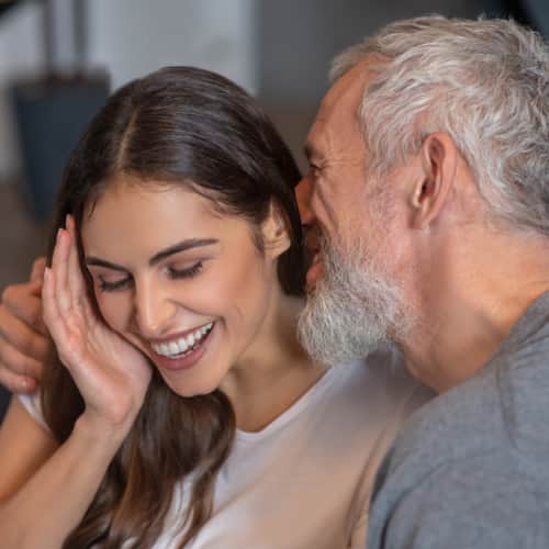 Old man complementing a woman 