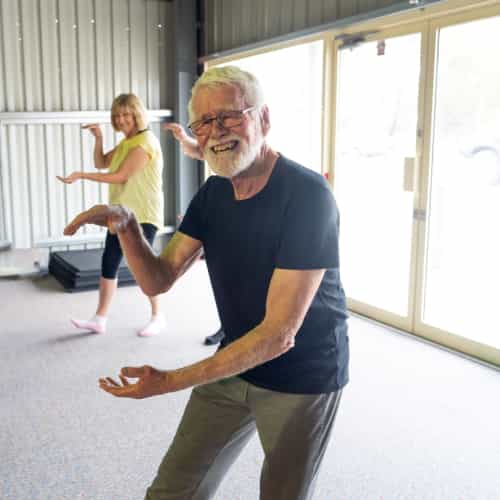 Senior man working out with a professional