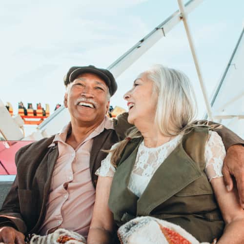 Senior couple enjoying at adventure park 