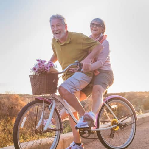 Senior couple enjoying cycling