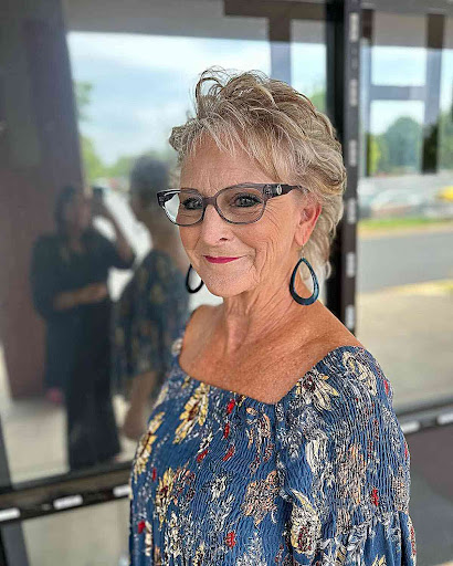 Long Blonde Hair and Round Glasses