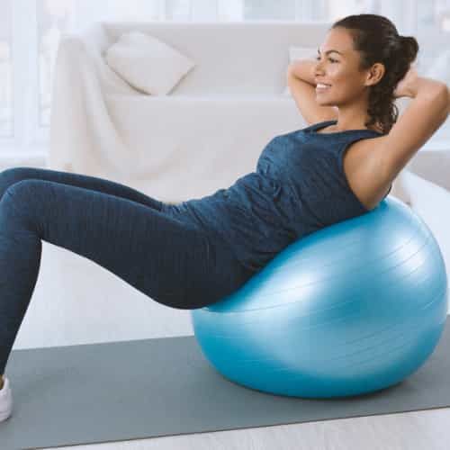 women working out on exercise ball  